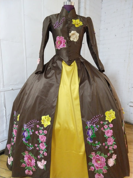 With heavy floral decoration Brown silk dress