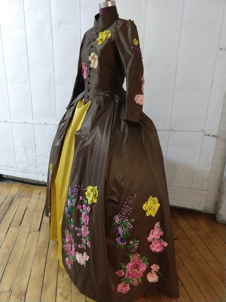 With heavy floral decoration Brown silk dress