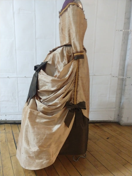 With attached petticoat and back ruffles Victorian cage bustle